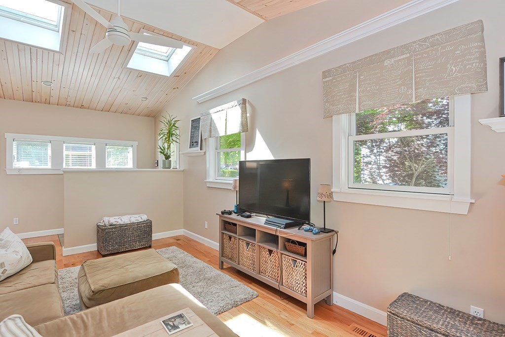 51 Albert Road Newton, MA 02466 - Photo 5 of 40 a living room with furniture and a flat screen tv