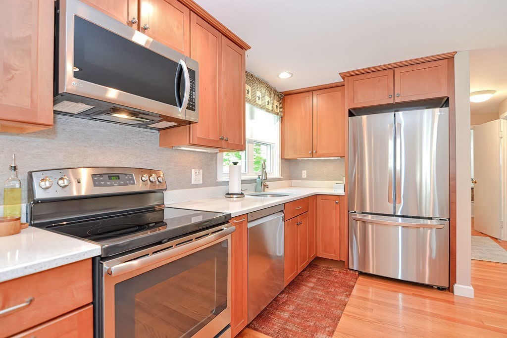 51 Albert Road Newton, MA 02466 - Photo 6 of 40 a kitchen with a refrigerator stove and microwave