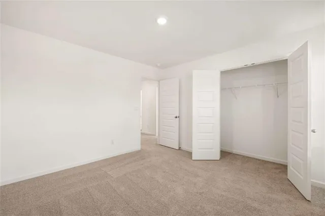 an aerial view of a house with a lake view