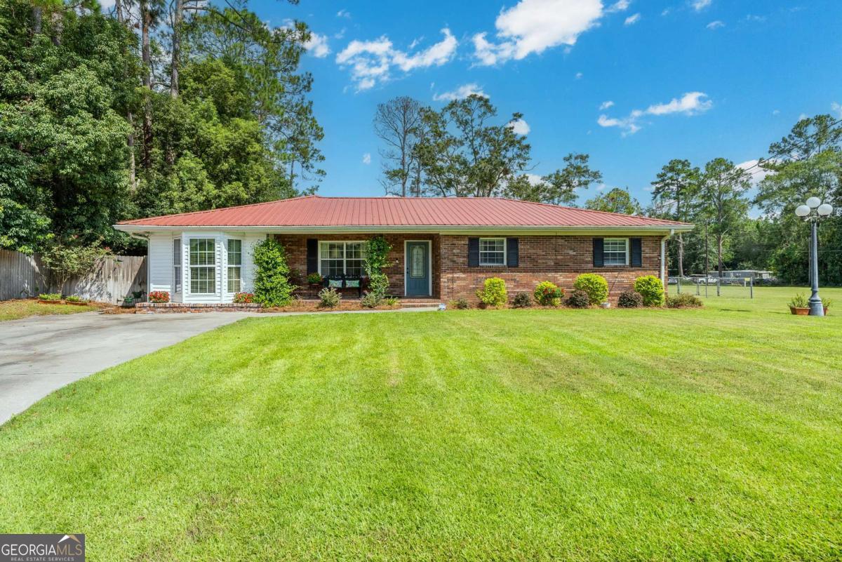 1238 Red Keen Road Waycross, GA 31503 - Photo 1 of 37 a view of a house with a big yard