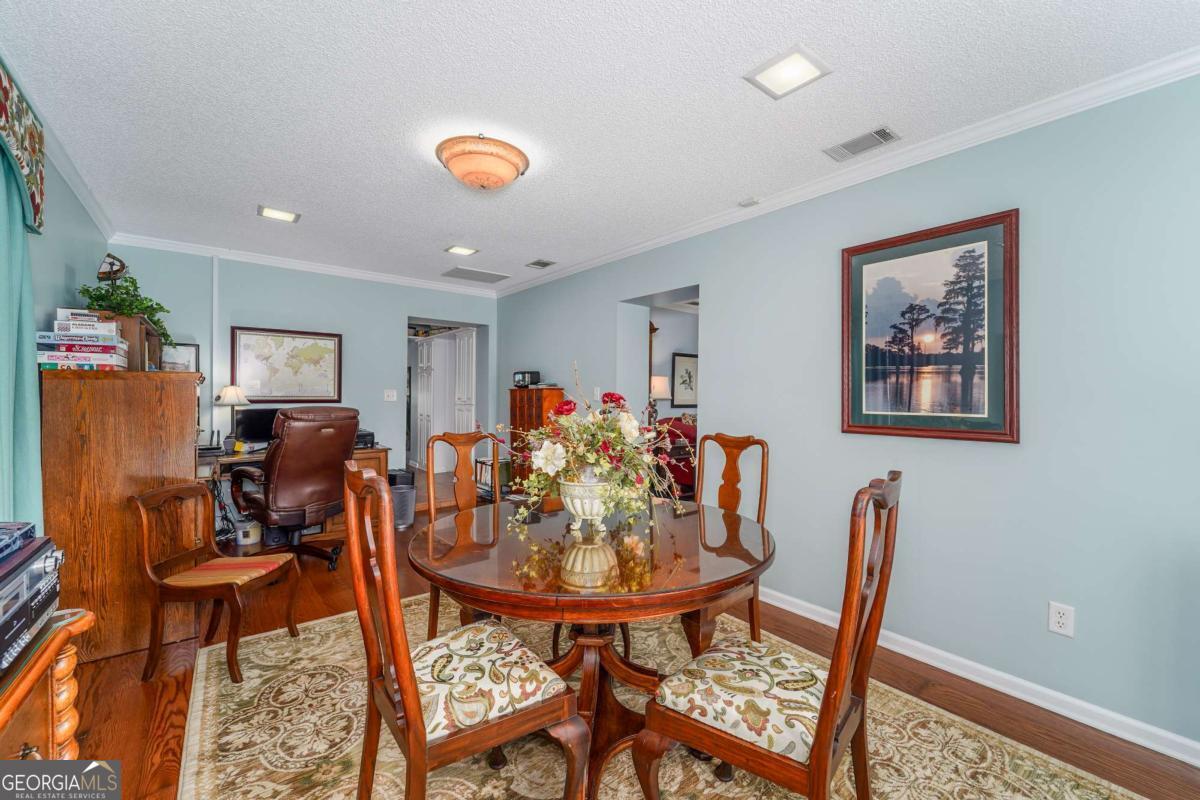 1238 Red Keen Road Waycross, GA 31503 - Photo 13 of 37 a view of a dining room with furniture