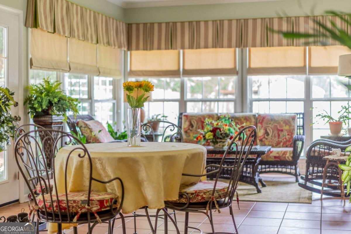 1238 Red Keen Road Waycross, GA 31503 - Photo 18 of 37 a view of a dining room with furniture window and outside view
