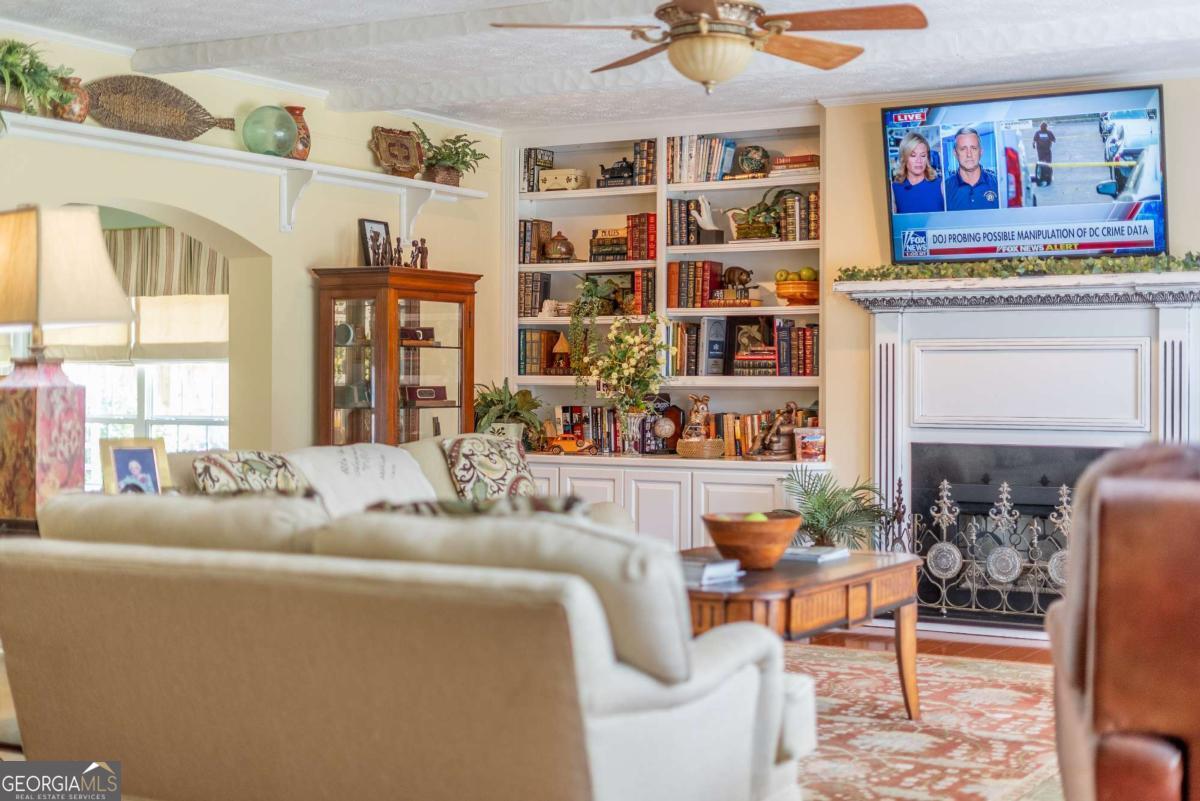 1238 Red Keen Road Waycross, GA 31503 - Photo 21 of 37 a living room with furniture cabinets and window