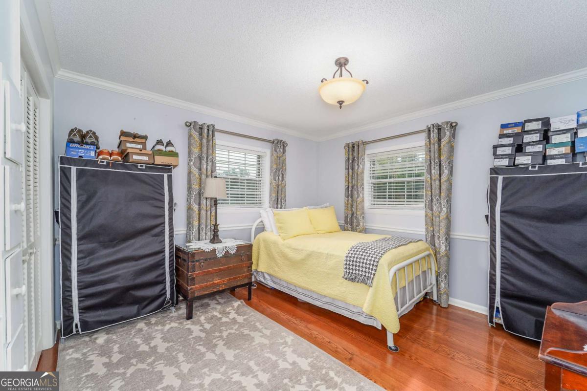 1238 Red Keen Road Waycross, GA 31503 - Photo 24 of 37 a bedroom with a bed and a window