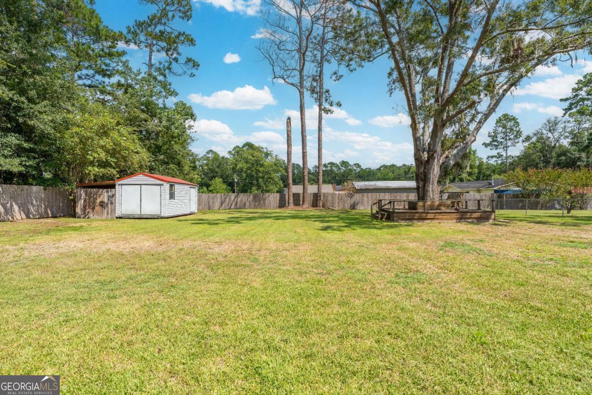 1238 Red Keen Road Waycross, GA 31503 - Photo 36 of 37 a view of an outdoor space and swimming pool