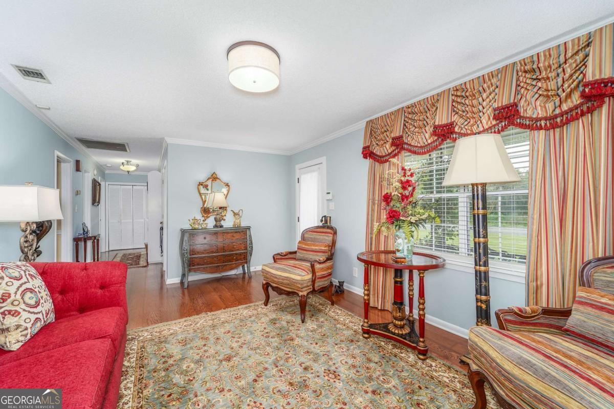 1238 Red Keen Road Waycross, GA 31503 - Photo 4 of 37 a living room with furniture and a large window