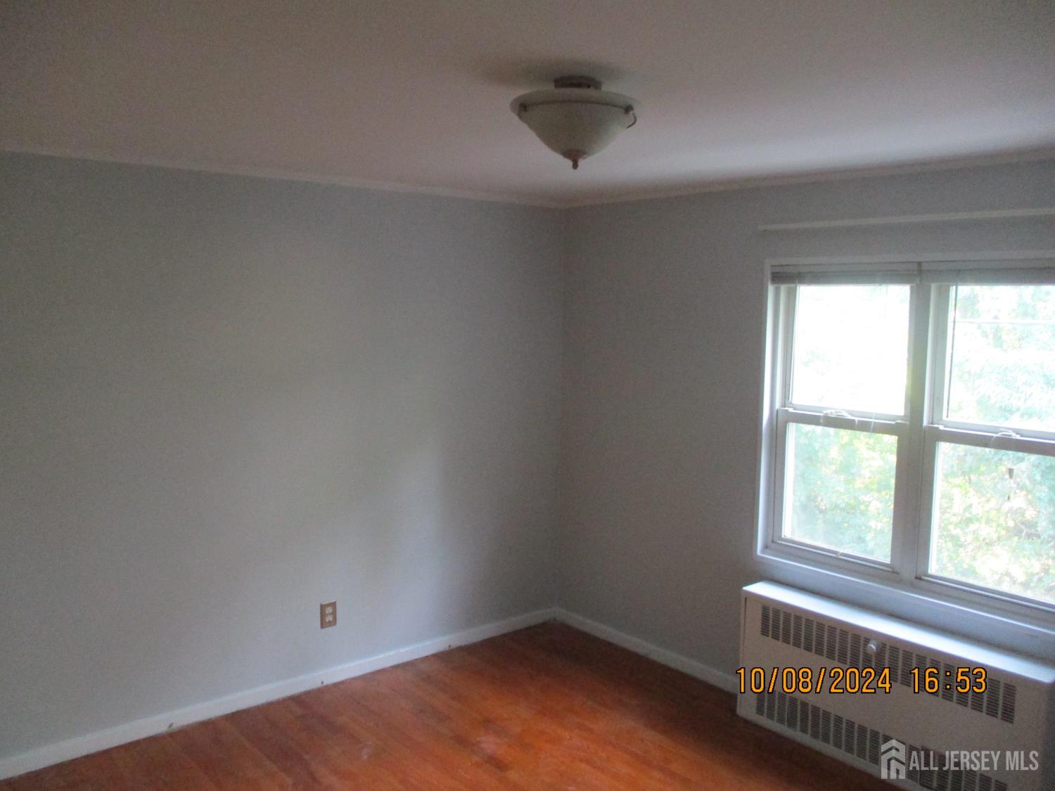 39A Garfield Park, Unit B Edison, NJ 08837 - Photo 2 of 11 an empty room with a window