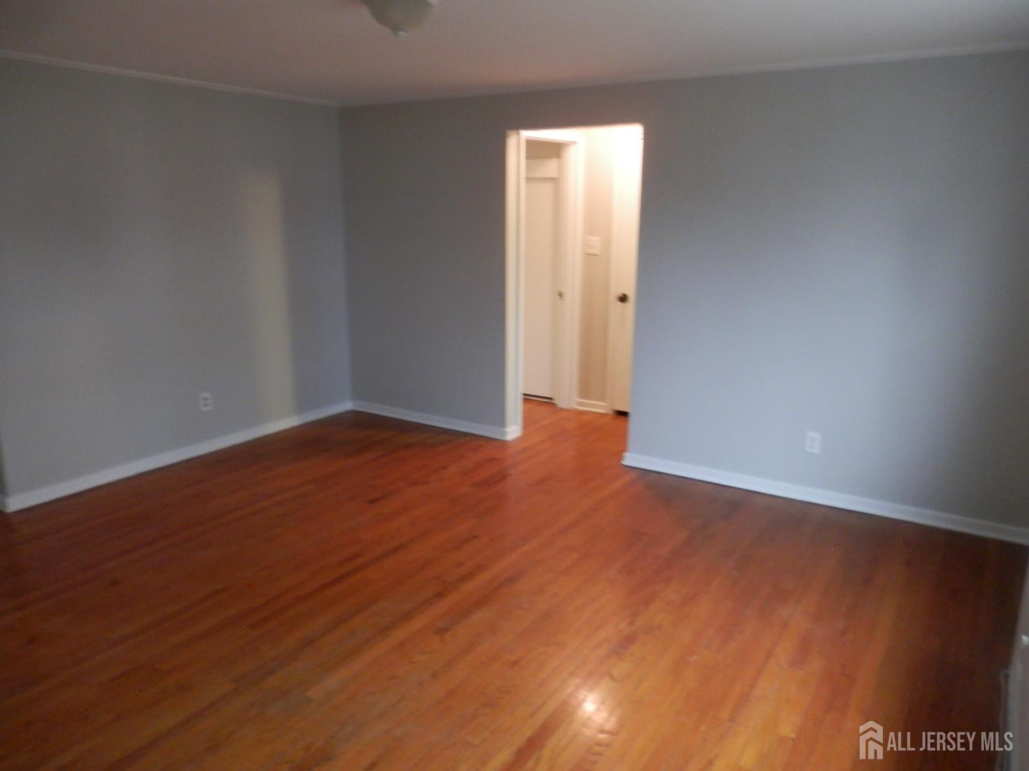 39A Garfield Park, Unit B Edison, NJ 08837 - Photo 7 of 11 a view of an empty room with wooden floor