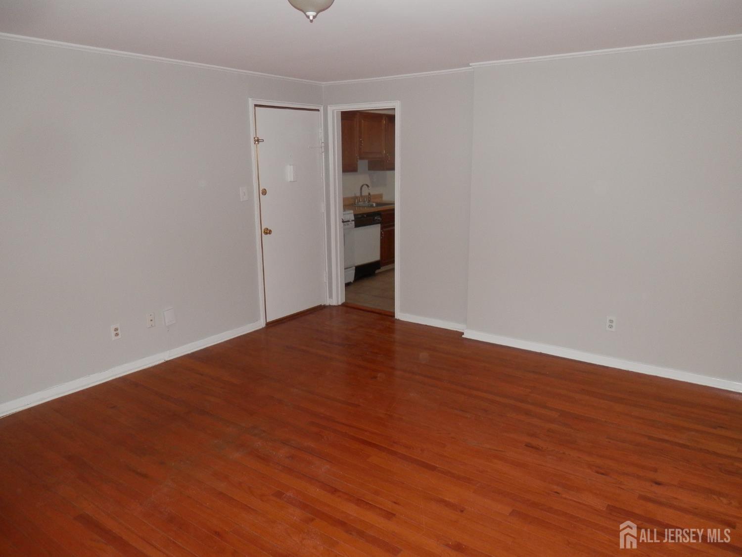 39A Garfield Park, Unit B Edison, NJ 08837 - Photo 10 of 11 a view of an empty room with wooden floor