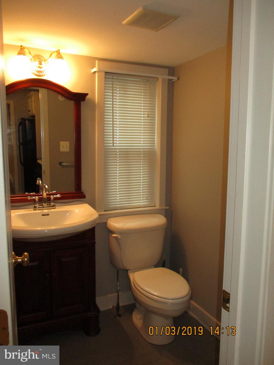 8727 Frederick Road Ellicott City, MD 21043 - Photo 7 of 19 Half bath off kitchen
