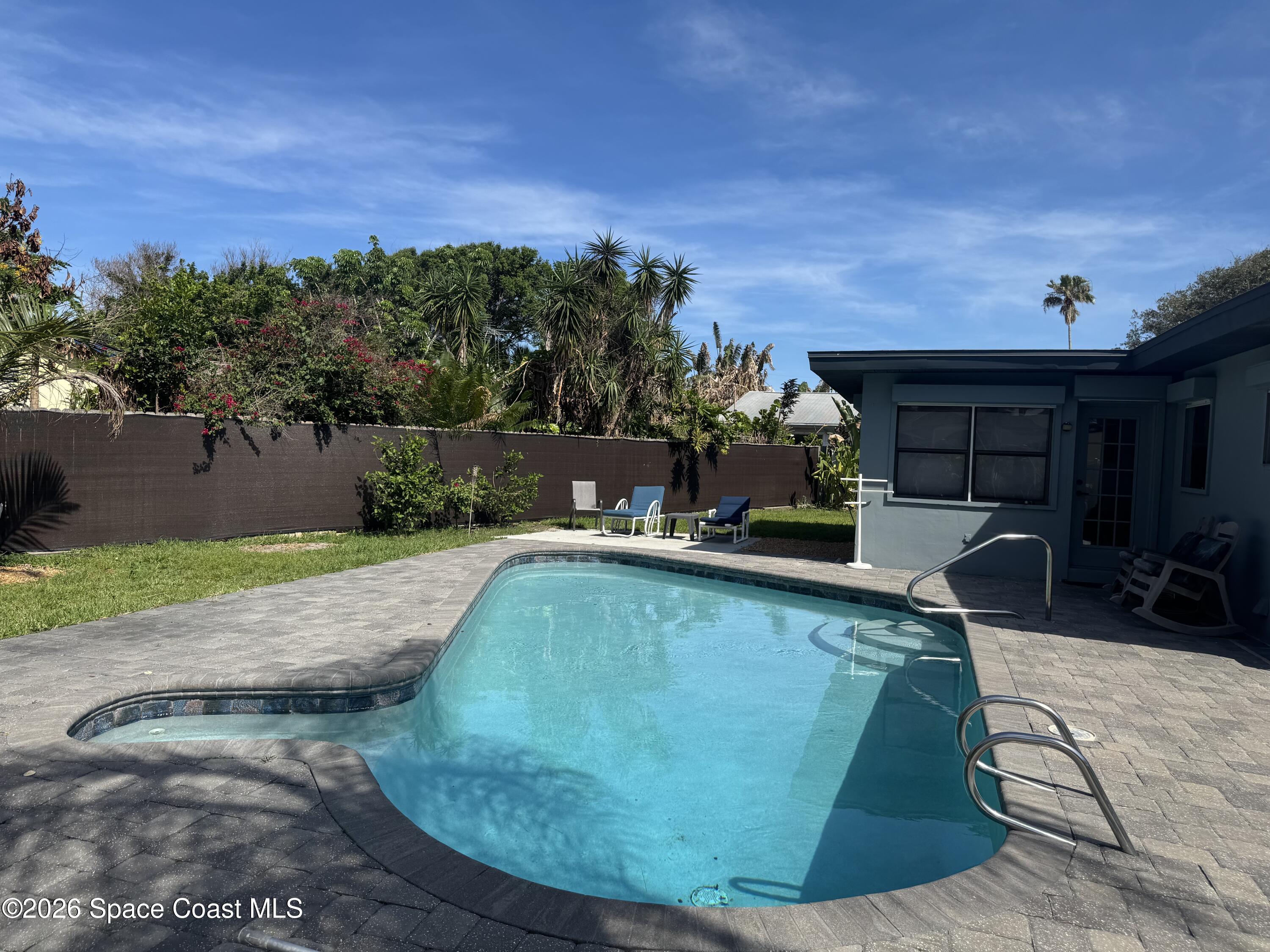2135 South River Road Melbourne Beach, FL 32951 - Photo 14 of 14 a view of a swimming pool with a patio