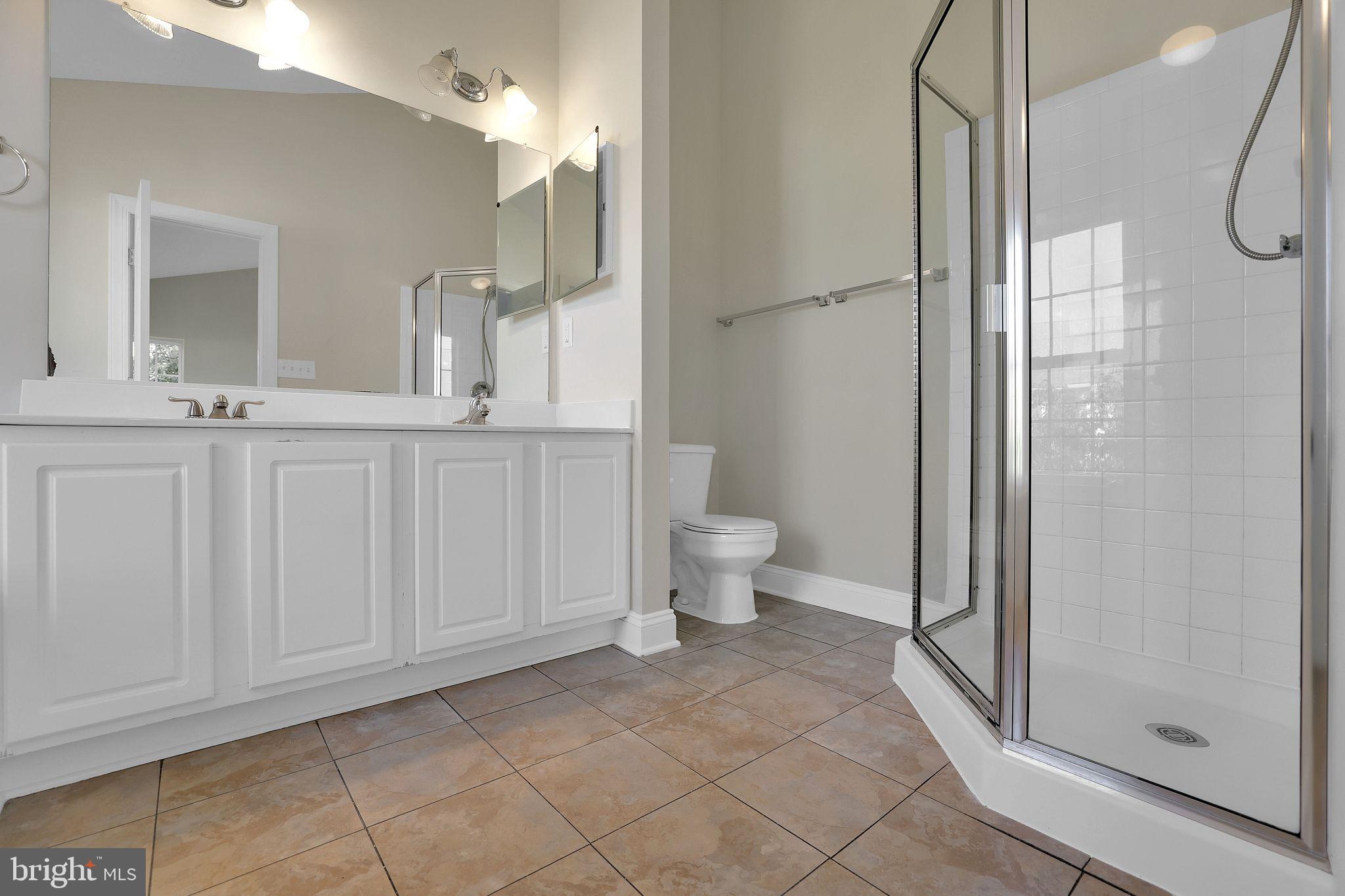 111 A Chevy Chase Street, Unit 111A Gaithersburg, MD 20878 - Photo 24 of 47 a bathroom with a toilet sink and shower