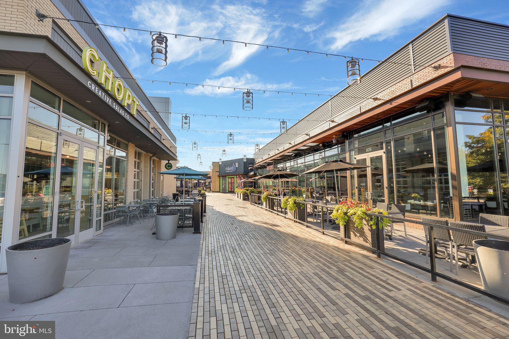 111 A Chevy Chase Street, Unit 111A Gaithersburg, MD 20878 - Photo 44 of 47 a view of a patio with table and chairs