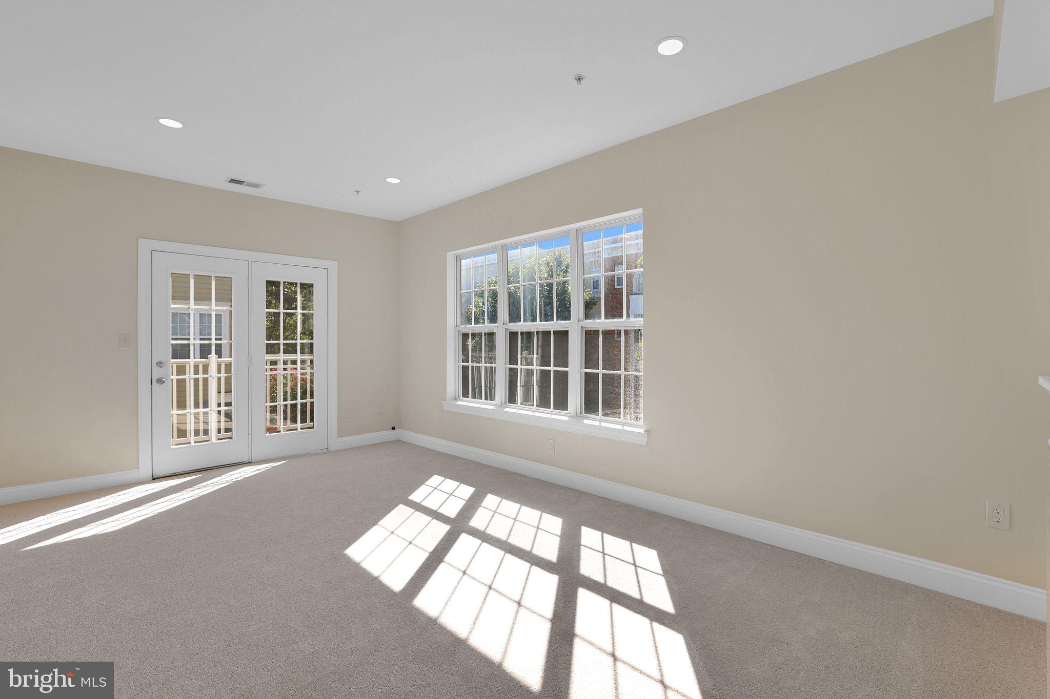 111 A Chevy Chase Street, Unit 111A Gaithersburg, MD 20878 - Photo 9 of 47 a view of an empty room with a window