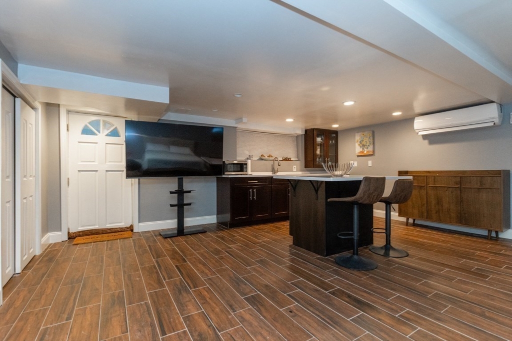 9 Bruce Street Burlington, MA 01803 - Photo 19 of 38 a view of kitchen with sink microwave and refrigerator