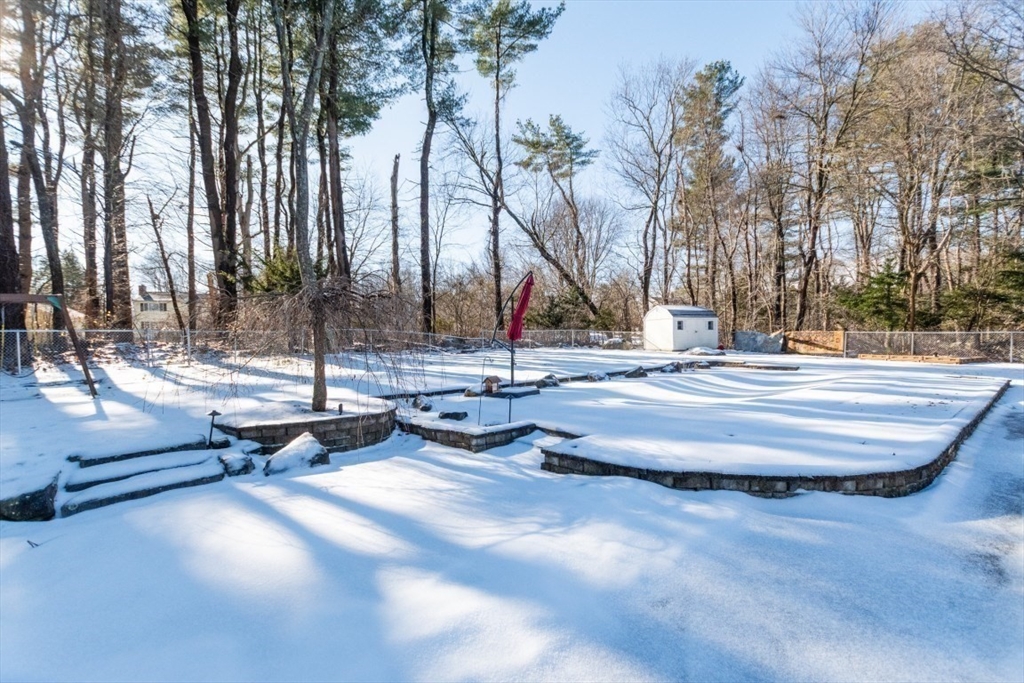 9 Bruce Street Burlington, MA 01803 - Photo 27 of 38 a swimming pool with outdoor seating and trees