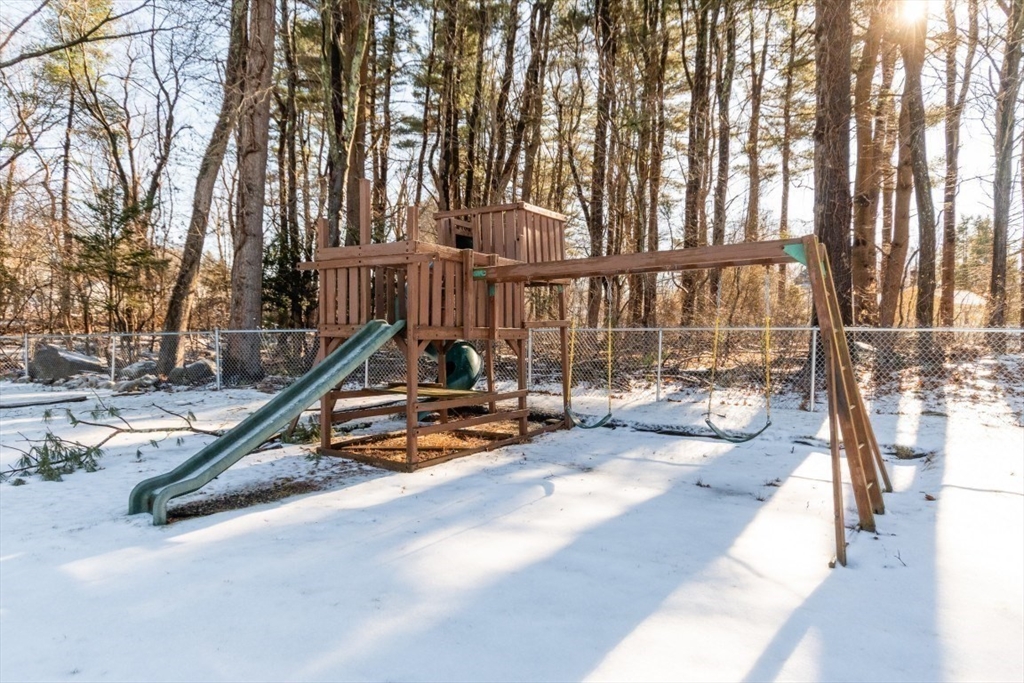 9 Bruce Street Burlington, MA 01803 - Photo 29 of 38 a view of a swimming pool with a patio and wooden fence