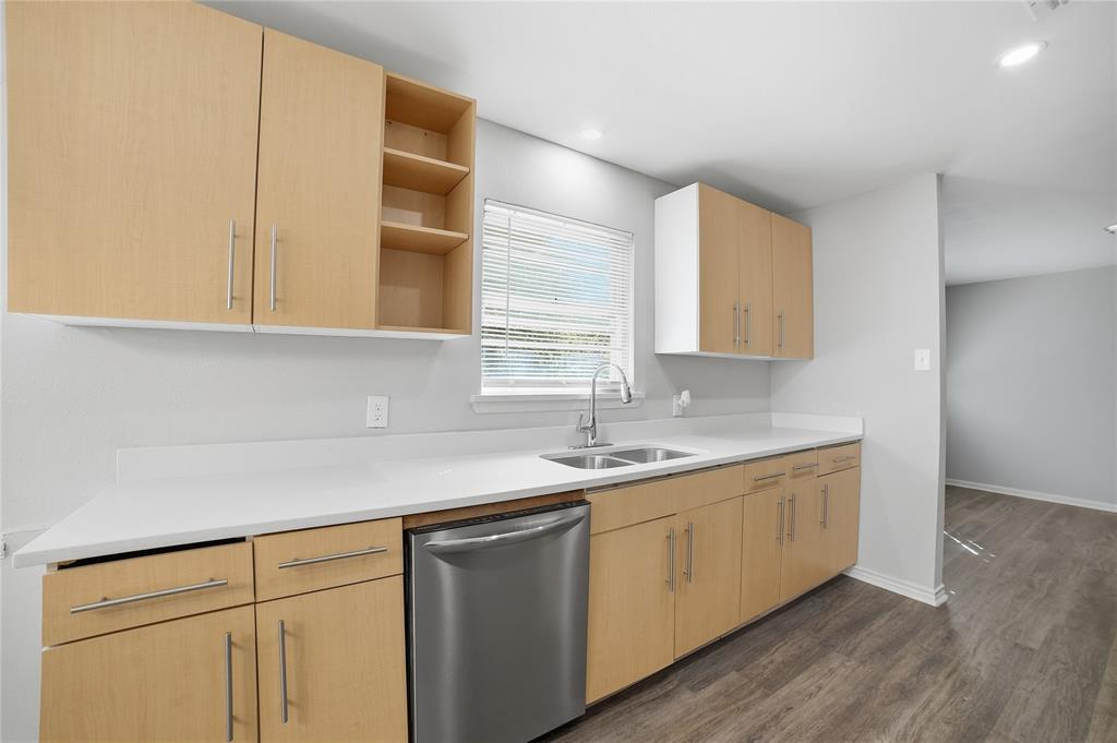 2926 North Prairie Creek Road Dallas, TX 75227 - Photo 13 of 22 a kitchen with a sink cabinets and a window