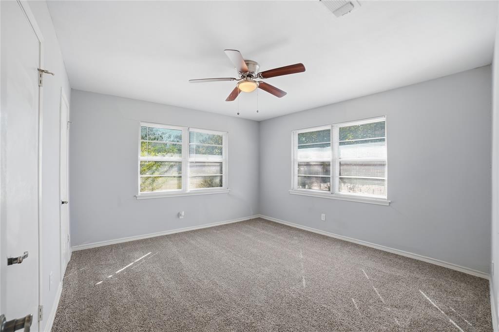 2926 North Prairie Creek Road Dallas, TX 75227 - Photo 17 of 22 a view of an empty room with a window