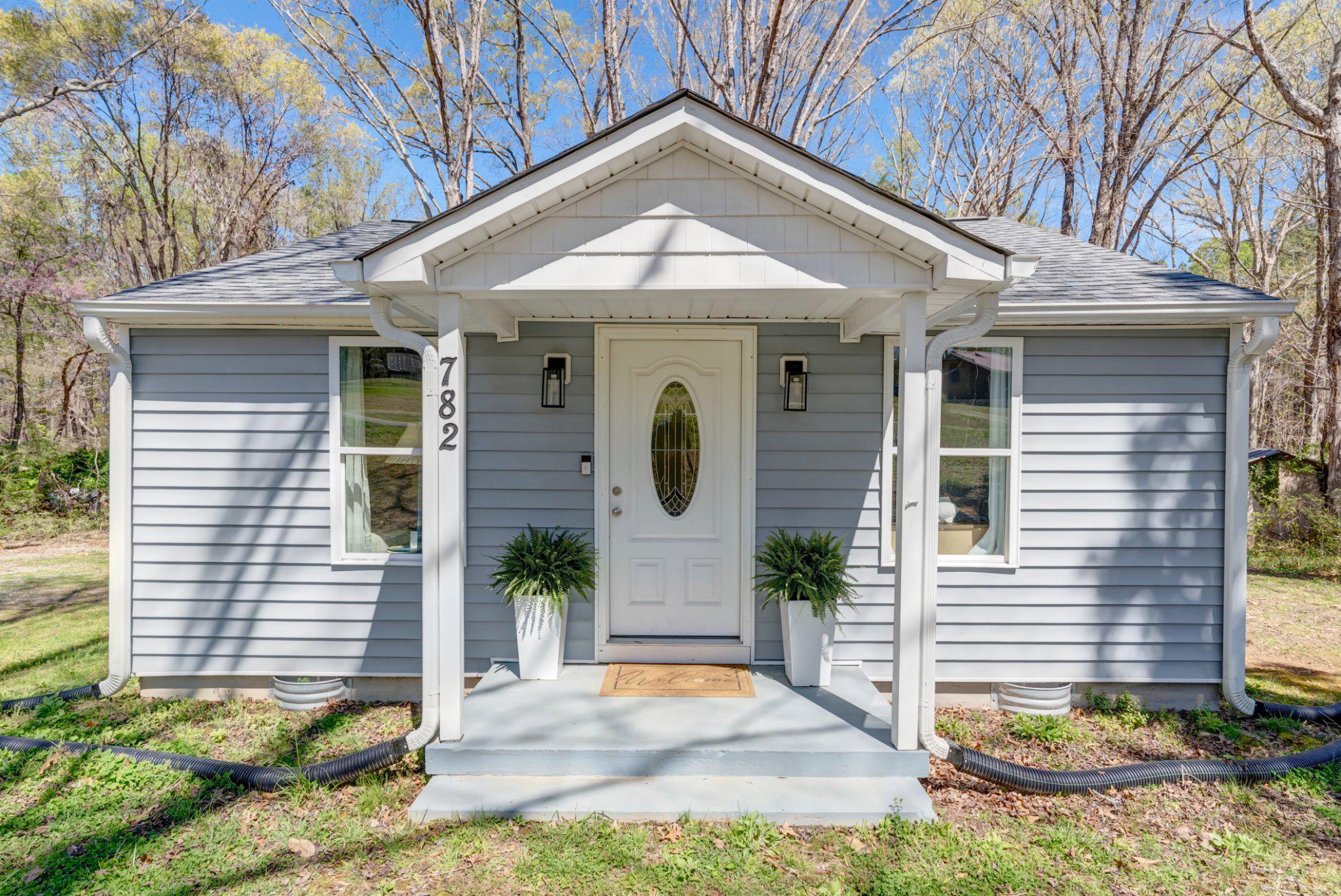 782 Mt Ararat Road Clarksville, VA 23927 - Photo 1 of 28 a front view of a house with garden