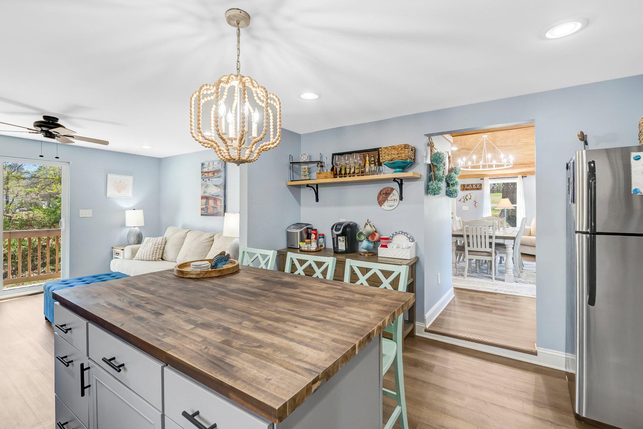782 Mt Ararat Road Clarksville, VA 23927 - Photo 11 of 28 a kitchen with a table chairs and a chandelier