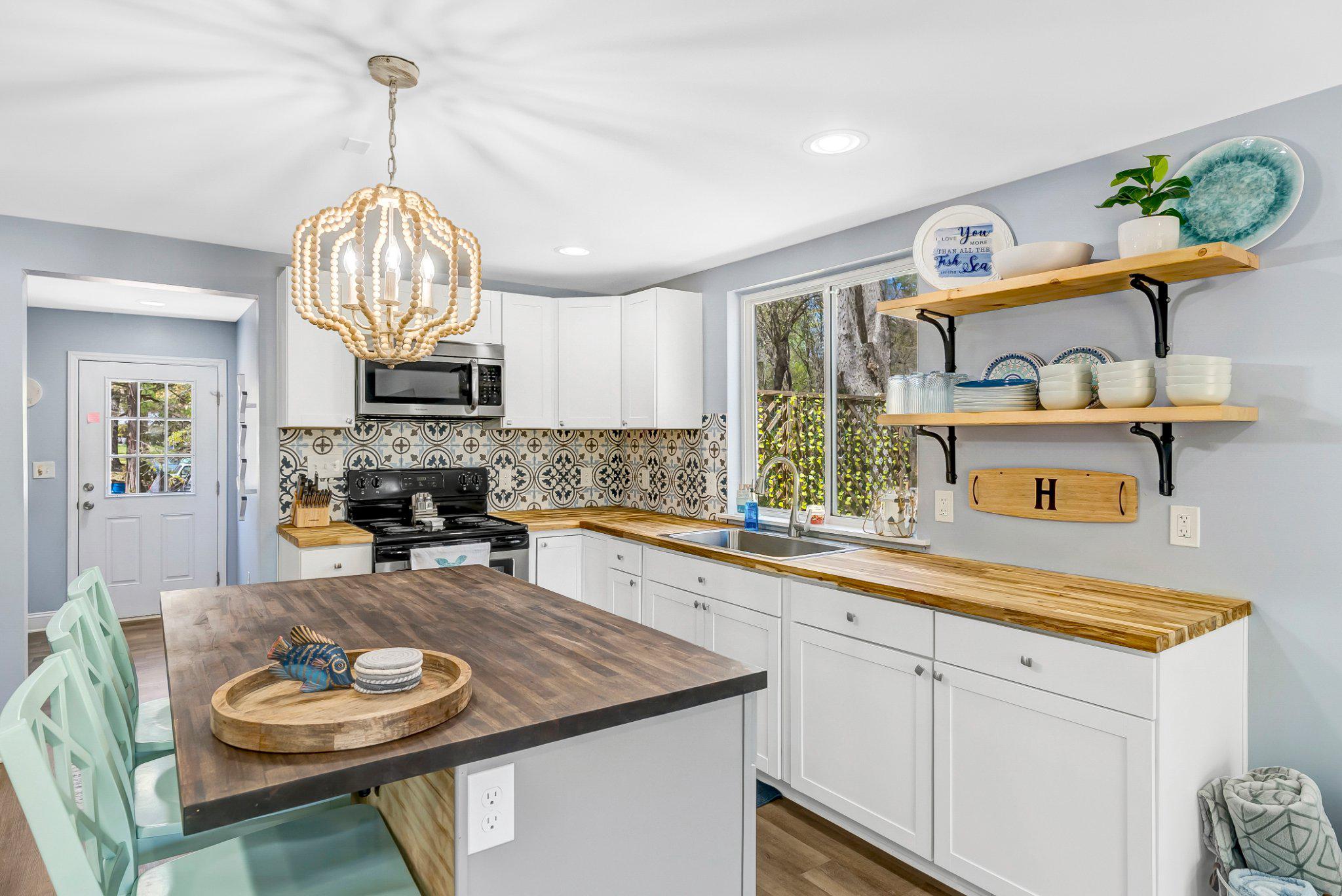 782 Mt Ararat Road Clarksville, VA 23927 - Photo 12 of 28 a kitchen with a dining table and chairs