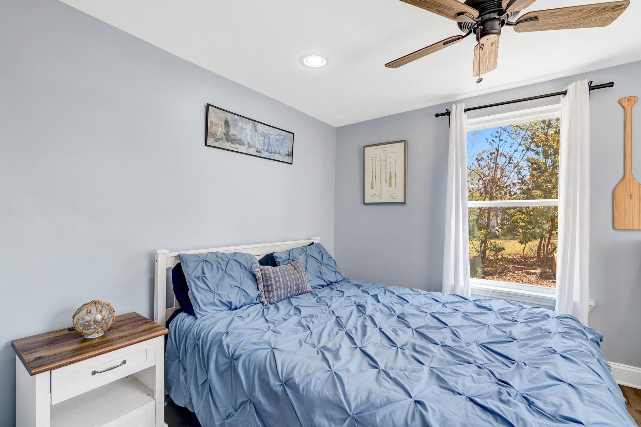 782 Mt Ararat Road Clarksville, VA 23927 - Photo 17 of 28 a bedroom with a bed and a window