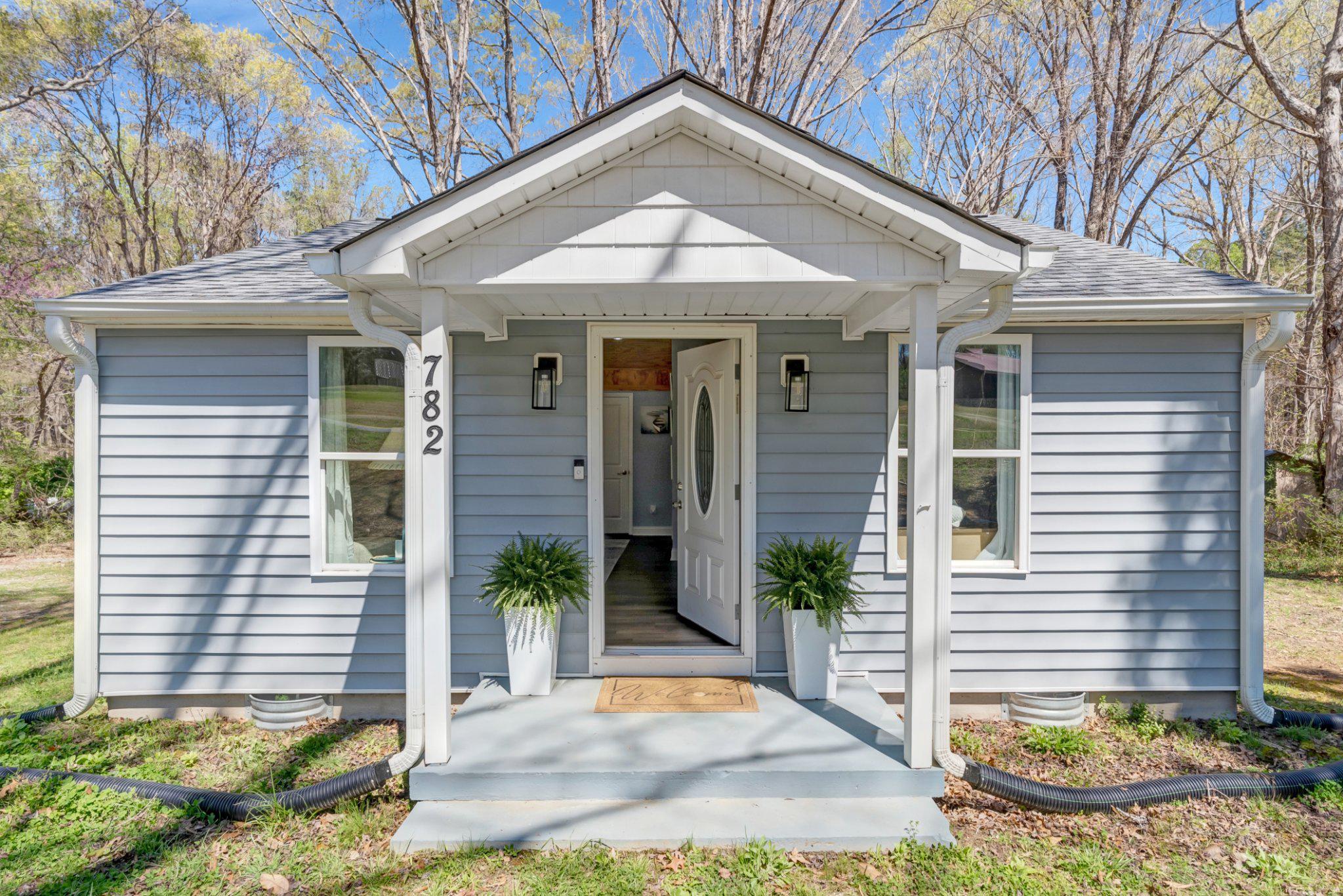 782 Mt Ararat Road Clarksville, VA 23927 - Photo 2 of 28 a front view of a house with garden