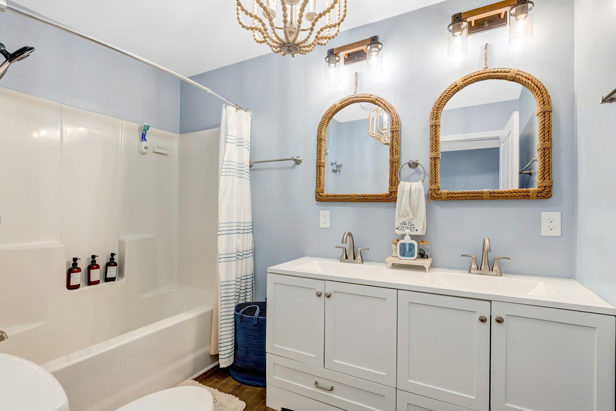 782 Mt Ararat Road Clarksville, VA 23927 - Photo 22 of 28 a bathroom with a double vanity sink mirror and bathtub