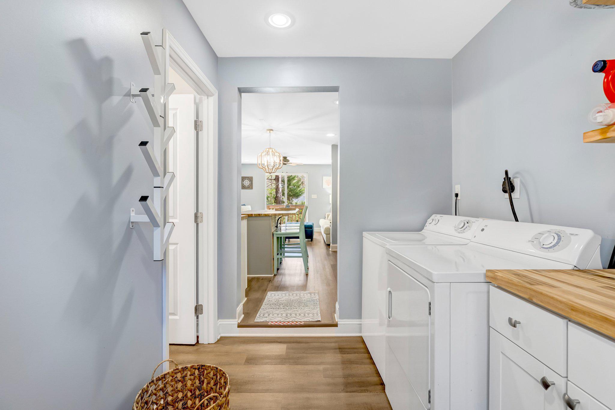 782 Mt Ararat Road Clarksville, VA 23927 - Photo 24 of 28 a view of a hallway with a dining table and a chandelier fan