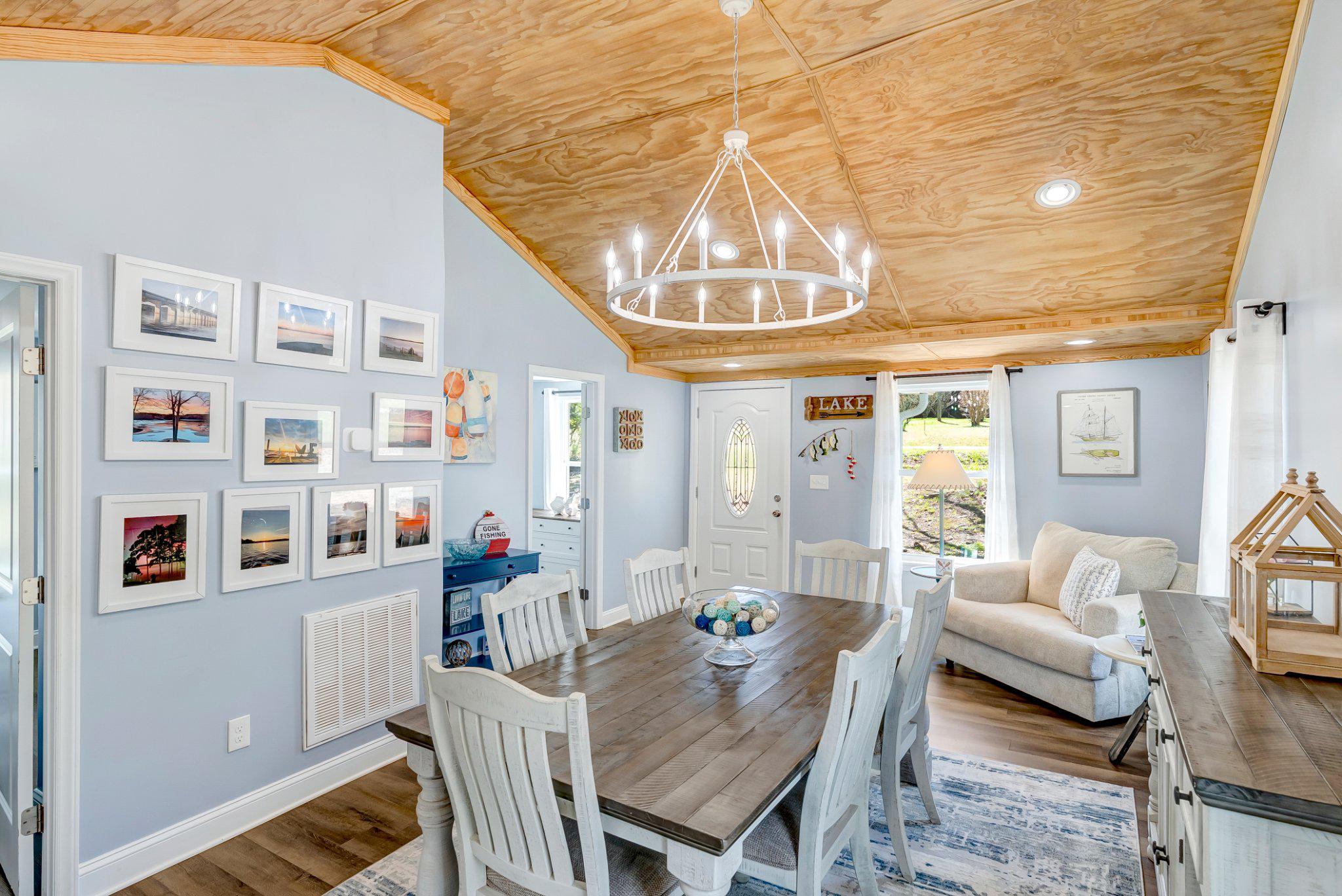 782 Mt Ararat Road Clarksville, VA 23927 - Photo 7 of 28 a view of a livingroom with furniture and a chandelier