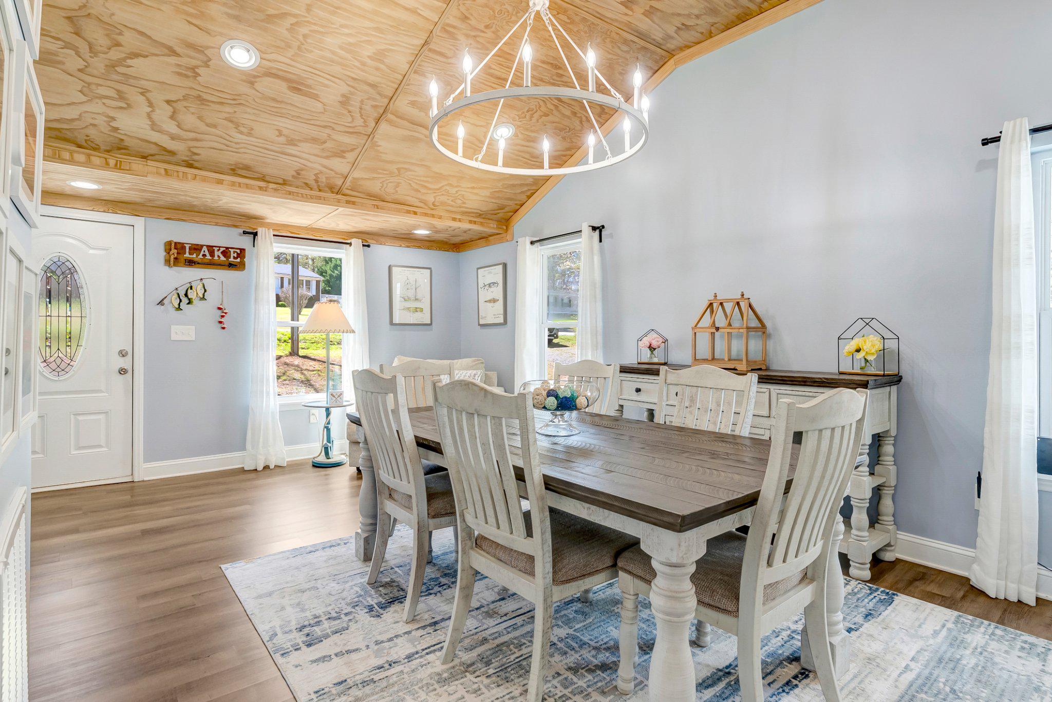 782 Mt Ararat Road Clarksville, VA 23927 - Photo 8 of 28 a view of a dining room with furniture and chandelier