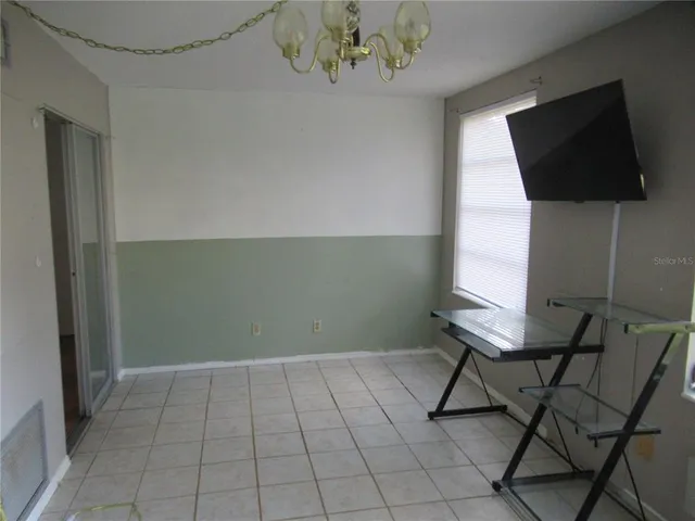 a view of an empty room with window