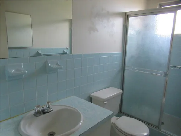 a bathroom with a sink and a toilet