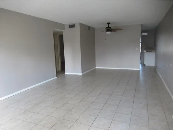 a view of an empty room with a window