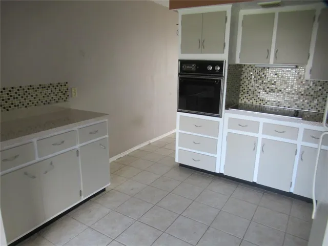 a view of a room with a flat screen tv and staircase