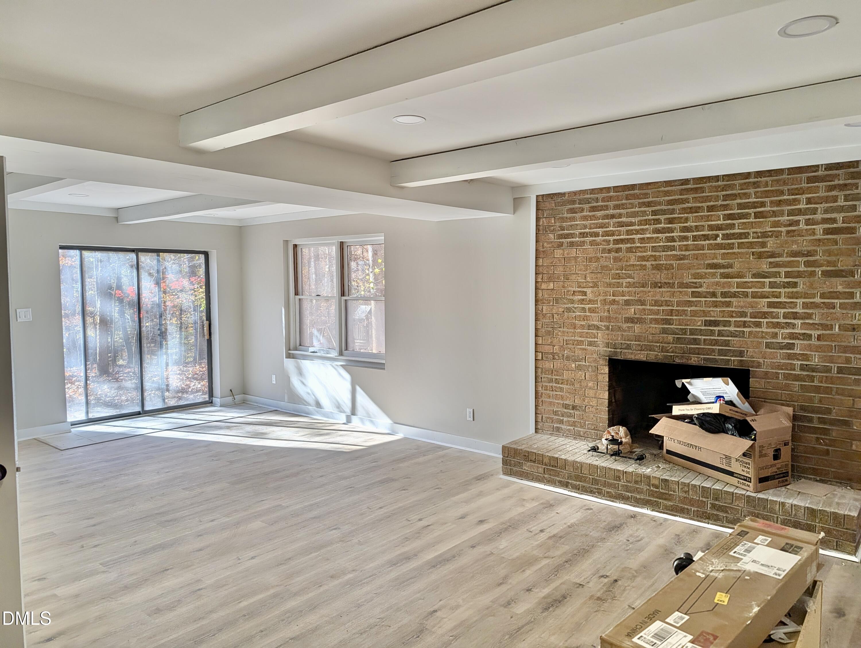 3412 Hackney Court Raleigh, NC 27613 - Photo 24 of 27 a view of a livingroom with wooden floor and a fireplace
