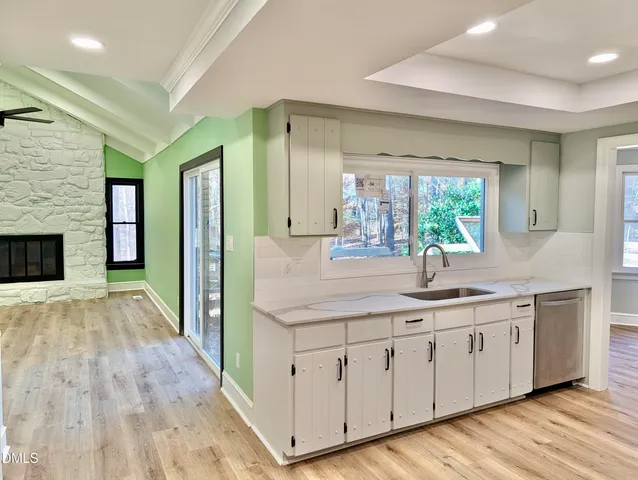 a spacious bathroom with a double vanity sink and a large mirror