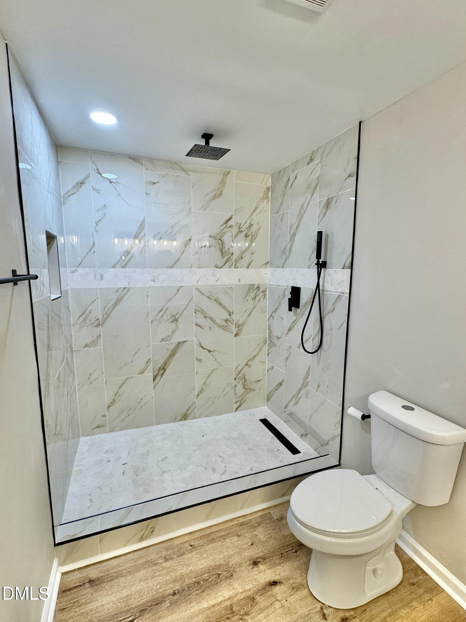 3412 Hackney Court Raleigh, NC 27613 - Photo 8 of 27 a bathroom with a toilet and a shower