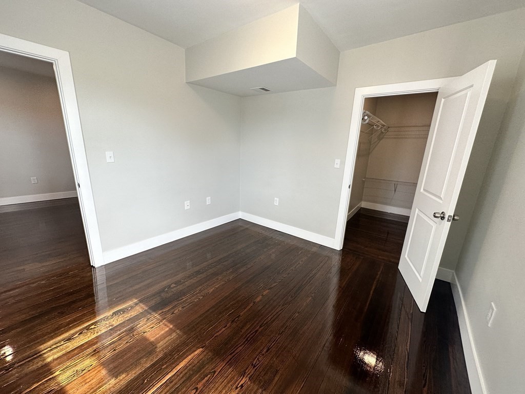 15 Tuttle Street, Unit 2 Revere, MA 02151 - Photo 14 of 17 an empty room with wooden floor and entrance