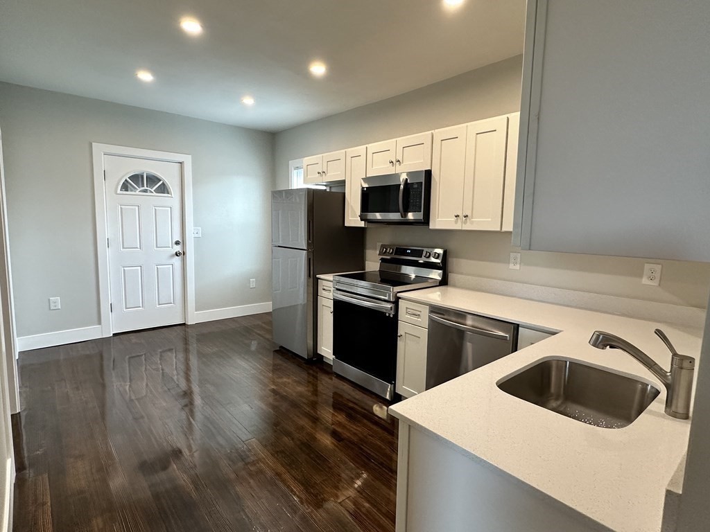 15 Tuttle Street, Unit 2 Revere, MA 02151 - Photo 2 of 17 a kitchen with a refrigerator stove and microwave