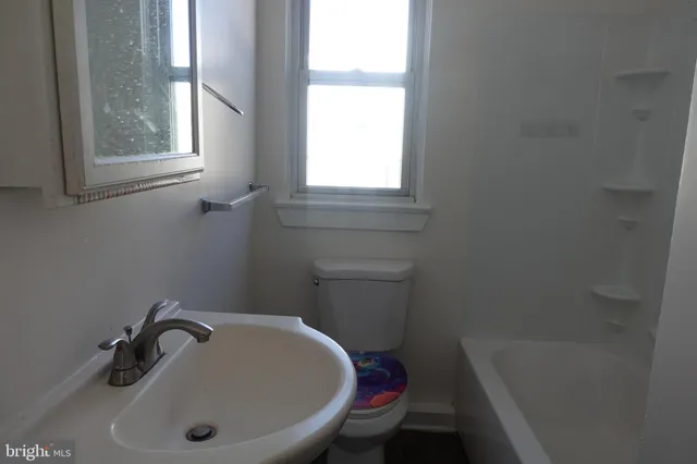 a bathroom with a sink and bathtub
