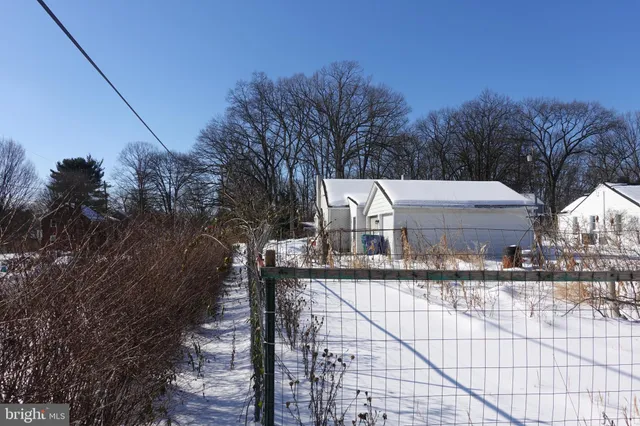 a view of a house with a snow in the background