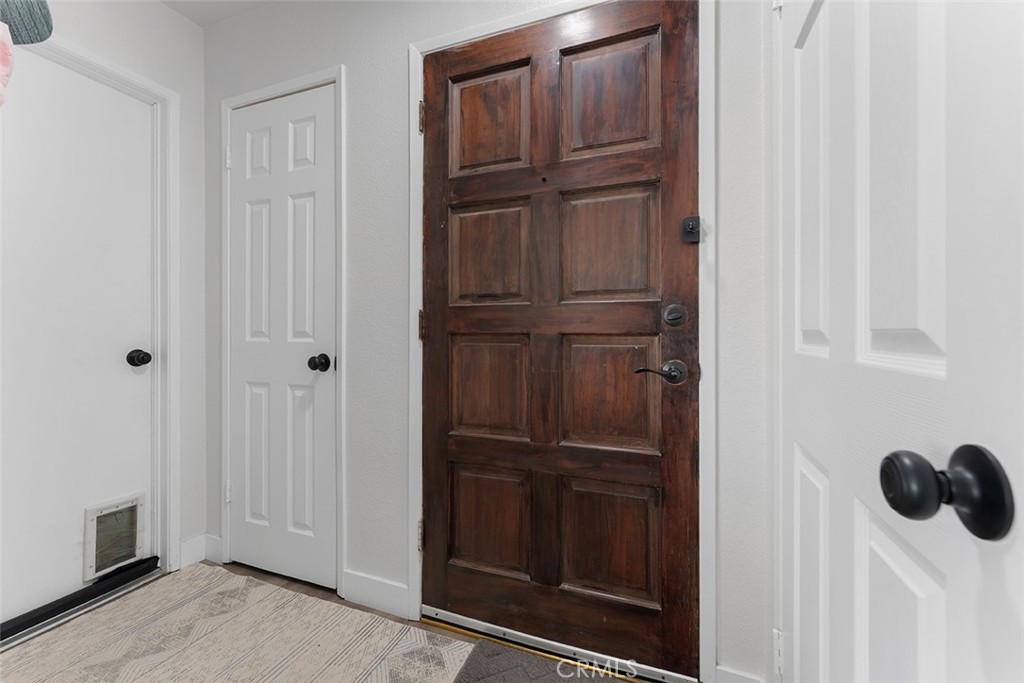 9595 Altadena Drive Riverside, CA 92503 - Photo 22 of 31 Entrance with closets and door to garage has a pet door. Laundry hookups in garage.