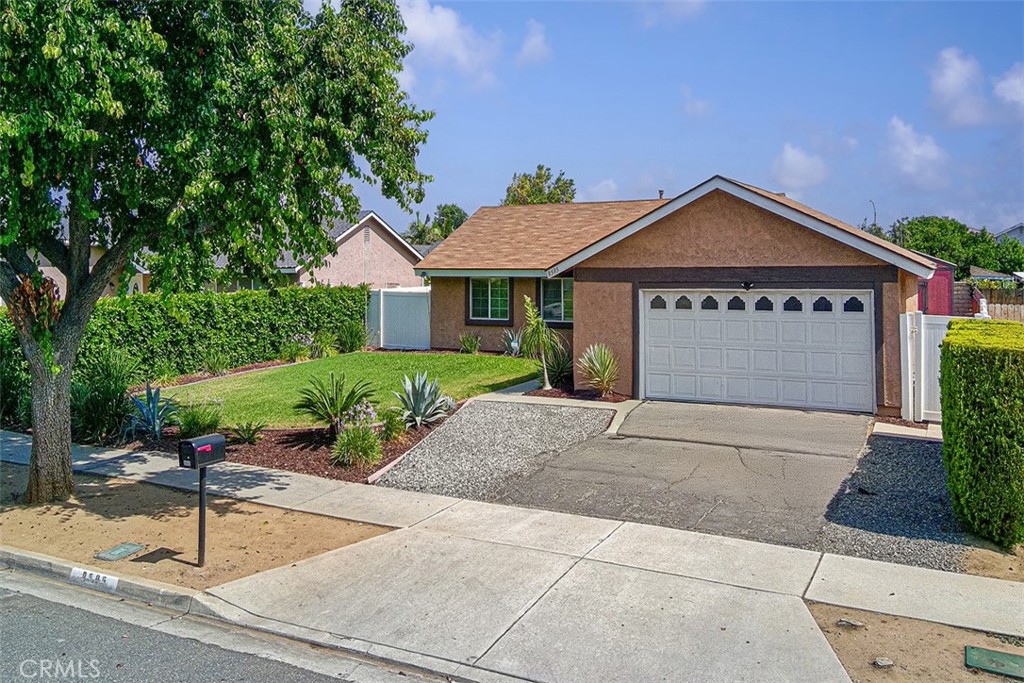 9595 Altadena Drive Riverside, CA 92503 - Photo 26 of 31 Cars were photoshopped out of the image. 2 car garage. Space to park 2 maybe 3.