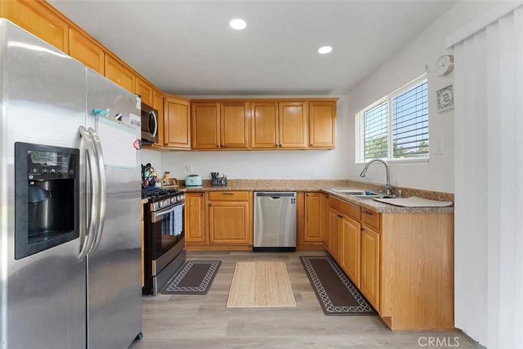 9595 Altadena Drive Riverside, CA 92503 - Photo 7 of 31 Kitchen with formica counters. Kitchen sink faces backyard.