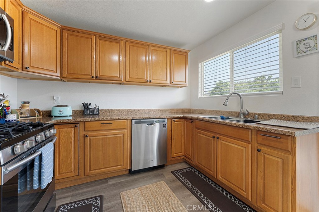 9595 Altadena Drive Riverside, CA 92503 - Photo 8 of 31 Kitchen with formica counters. Kitchen sink faces backyard.