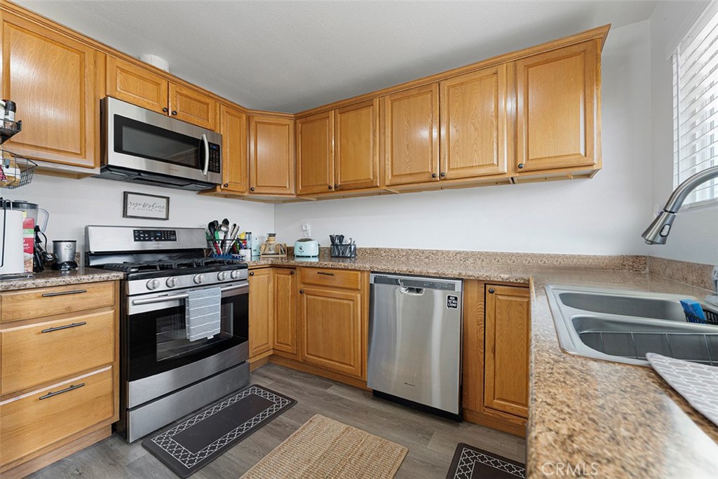 9595 Altadena Drive Riverside, CA 92503 - Photo 9 of 31 Kitchen with formica counters. Kitchen sink faces backyard.
