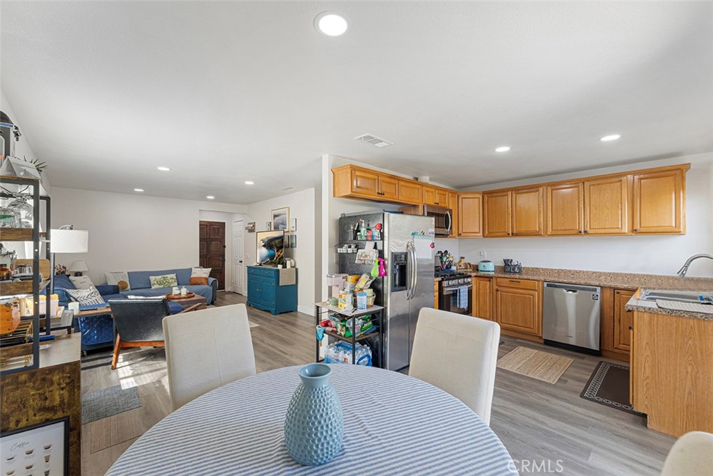 9595 Altadena Drive Riverside, CA 92503 - Photo 10 of 31 Open space living looking from the dining area towards kitchen and living room.