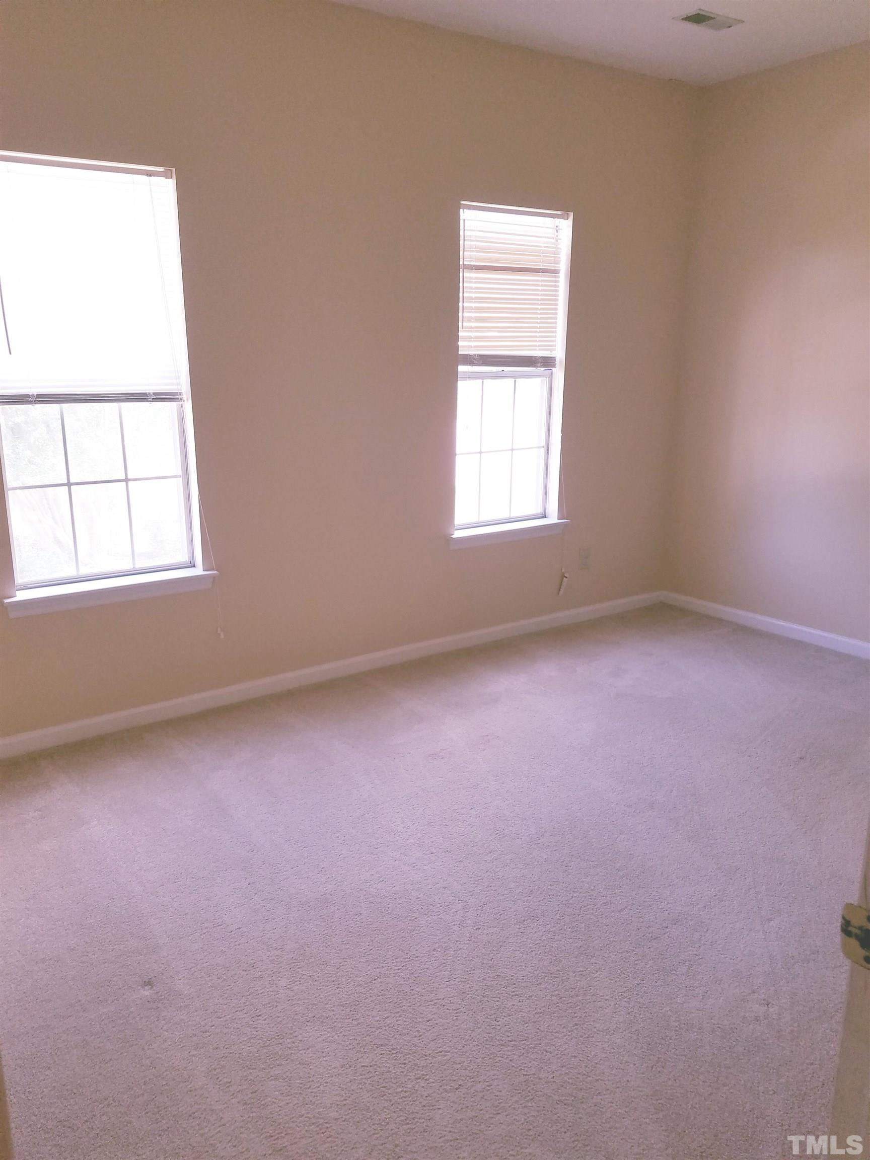 1815 Collier Road Durham, NC 27707 - Photo 11 of 14 an empty room with a window